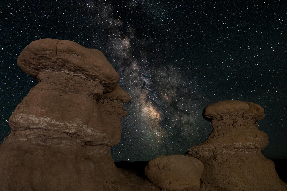 A vibrant Milky Way over some goblins